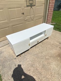 White tv stand 54 inch long and 15 1/2 inch wide and 20 inch tall
