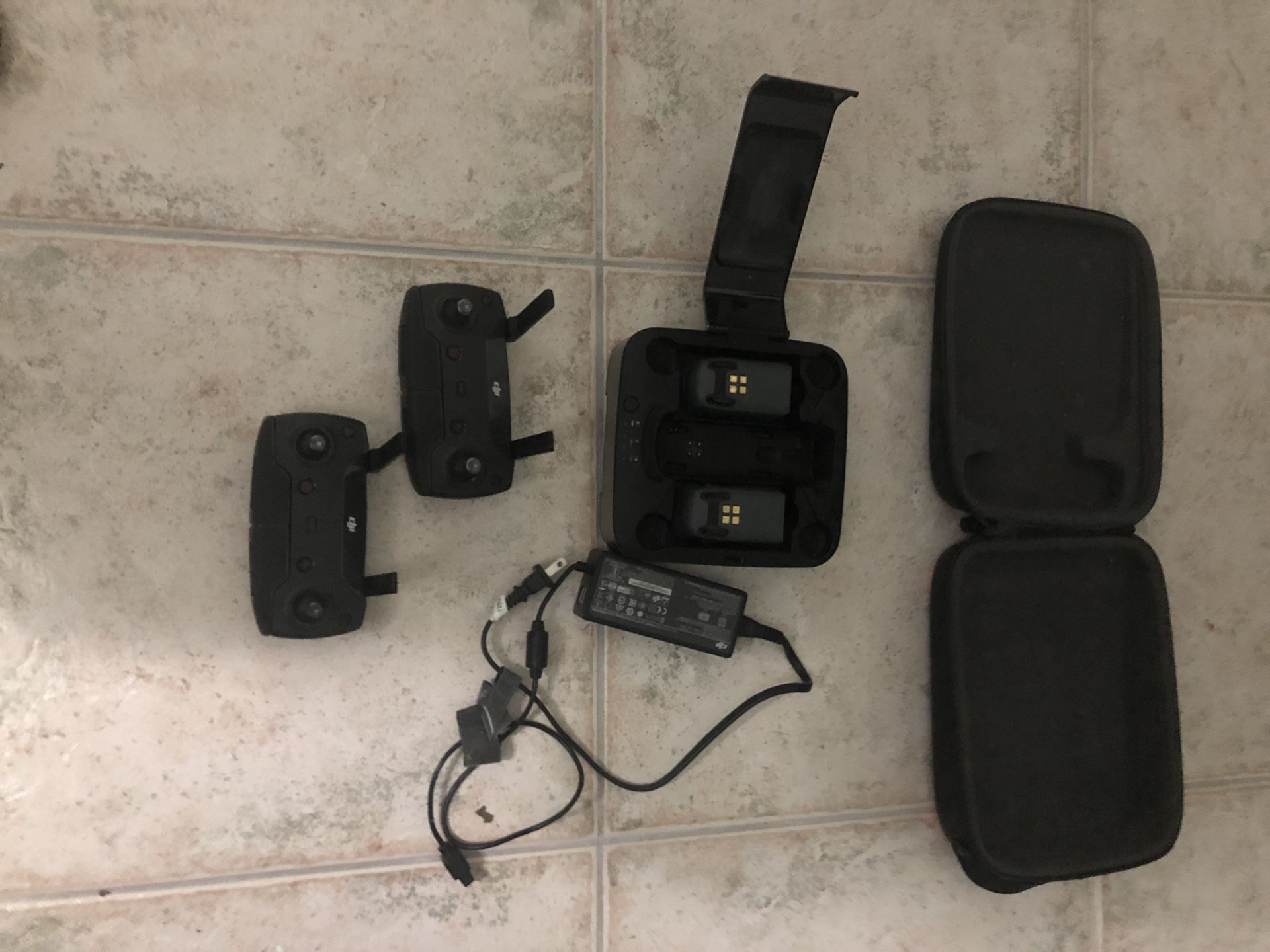 This is a DJI battery pack with two batteries, and two controllers and you don’t even have to plug it in so you can be charging! They are like beef