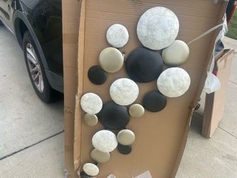 Metal circular pebble discs wall art