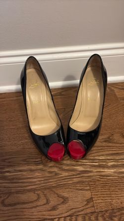 Christian Louboutin patent leather pumps