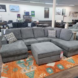 New 2pc Sectional And Storage Ottoman In Putty