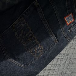 blue empyre jeans like new with designs on back pockets