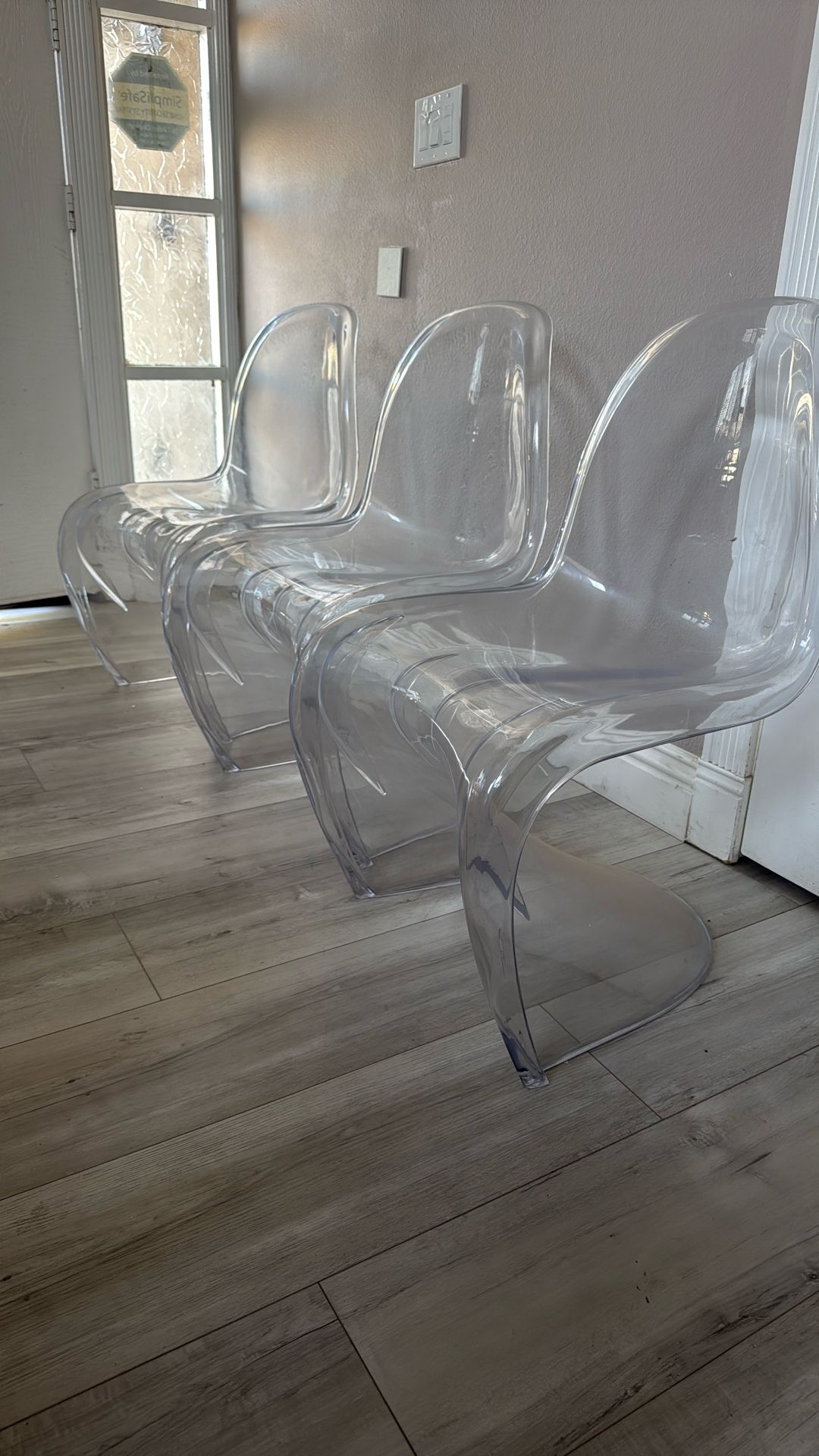 Three Clear Chairs