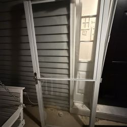 Anderson storm door with slide down glass to screen top 79 1/2 long 35 1/4 wide