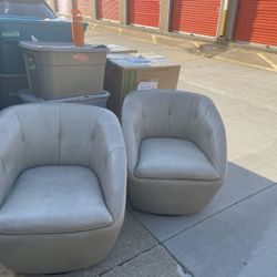 2 Beige Swivel Chairs