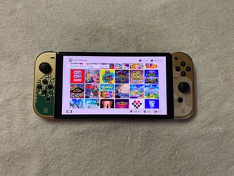 NINTENDO SWITCH OLED + 125 POPULAR SWITCH GAMES