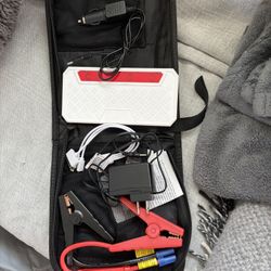 NEW IN CASE! portable car jump starter kit with a 10000mAh power bank