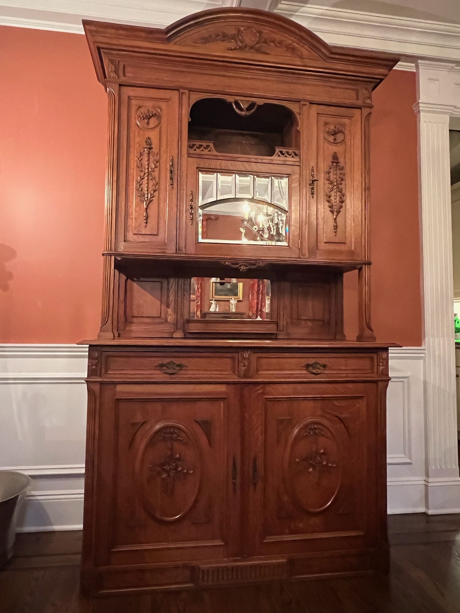 Antique Carved French Buffet Cabinet in Oak—Great Condition Gorgeous Details. Plate rack. Mirror door. Three upset cabinets with shelving. Two drawers