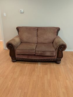 gently used vintage brown love seat