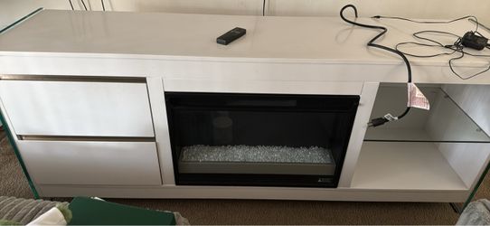Tv stand with fire place and remote