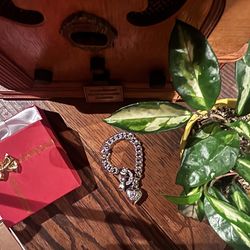 Juicy Couture charm bracelet with bow.