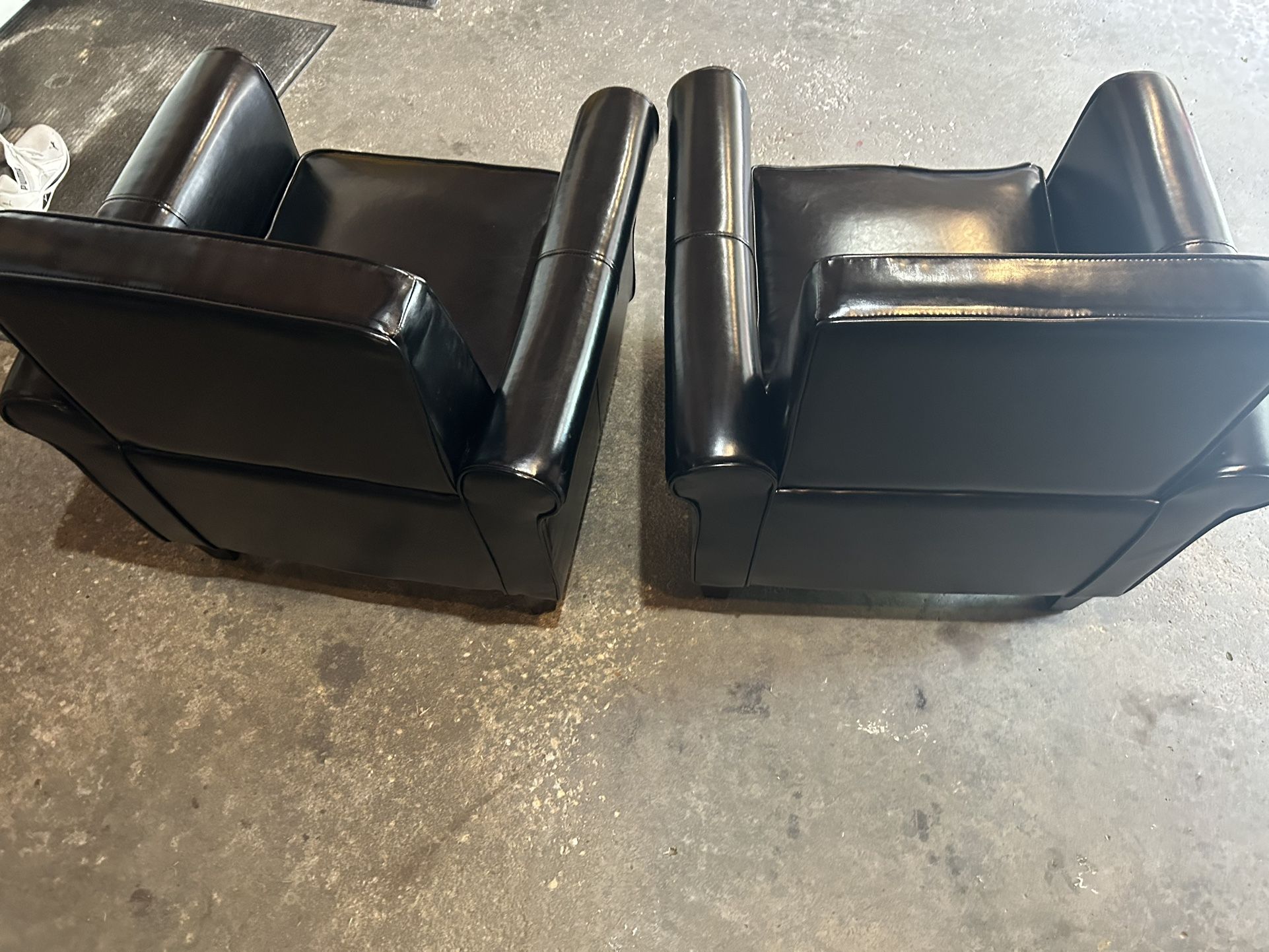 Set Of Black Chairs 32” Tall 30” X 28” Wide In good condition, no tears or rips.