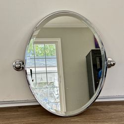 Oval Polished Chrome Framed Bathroom Mirror.