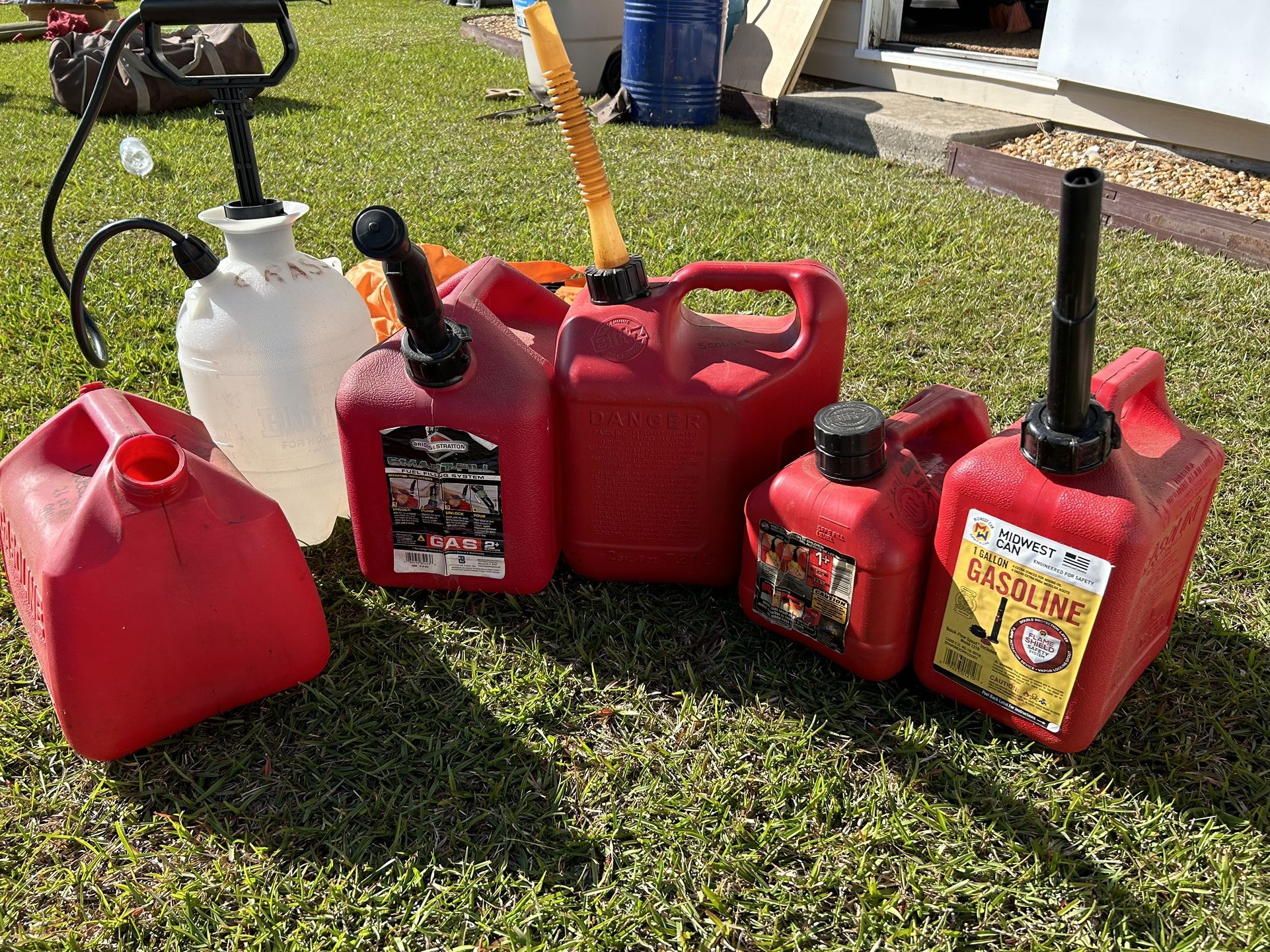 5 Gas Cans. Yard Sprayer.  