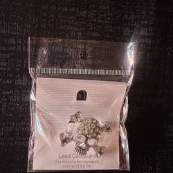 Silver skull brooch