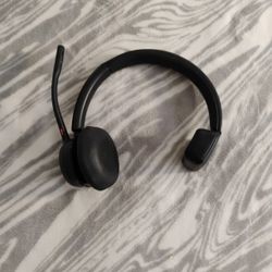 Poly (formerly Plantronics) Voyager 4310 wireless noise-canceling single-ear headset. 