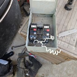  an electrical disconnect box containing two GFCI (Ground Fault Circuit Interrupter) circuit breakers. 