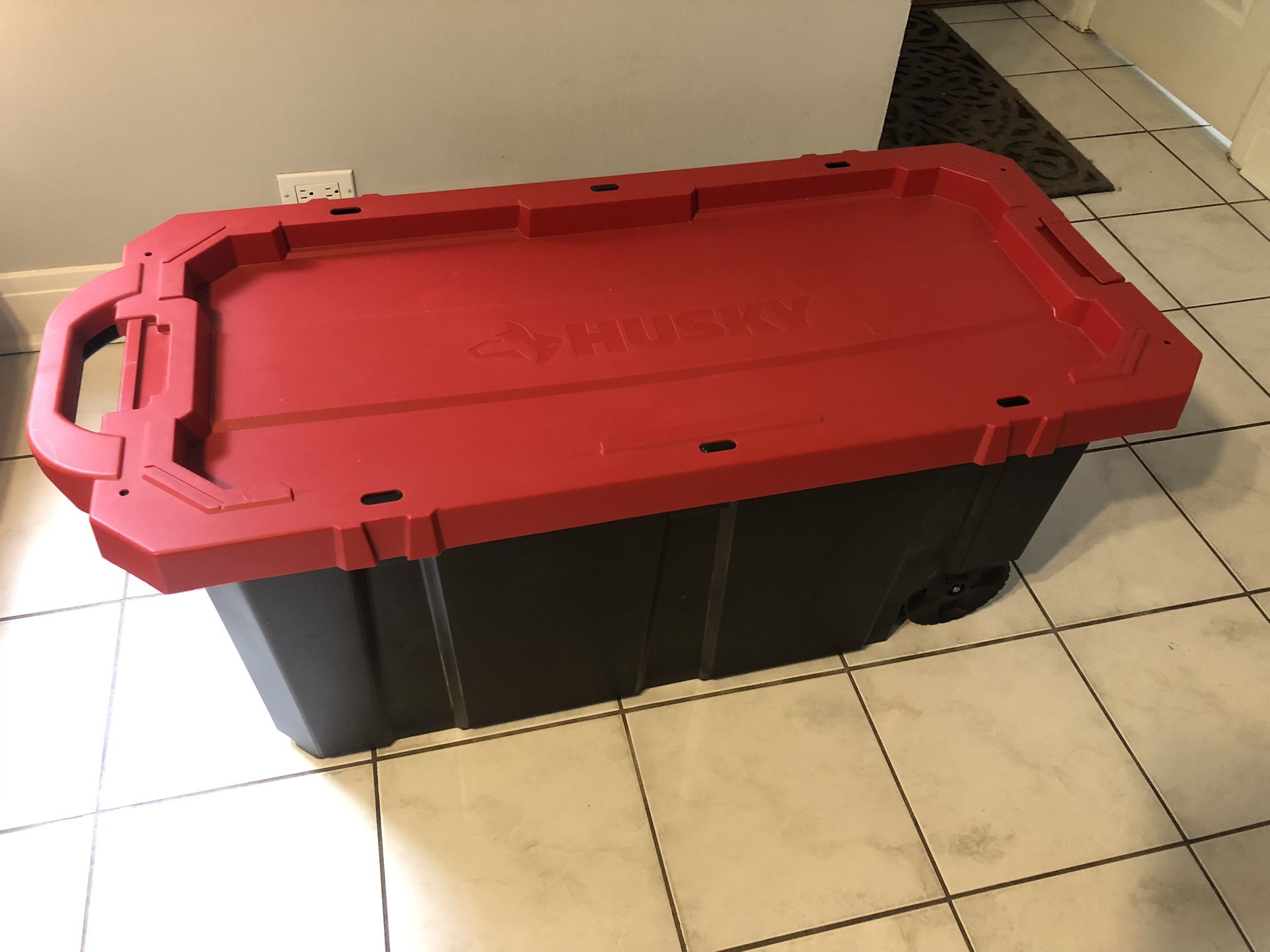 Husky 45 Gal. Latch and Stack Tote with Wheels in Black with Red Lid