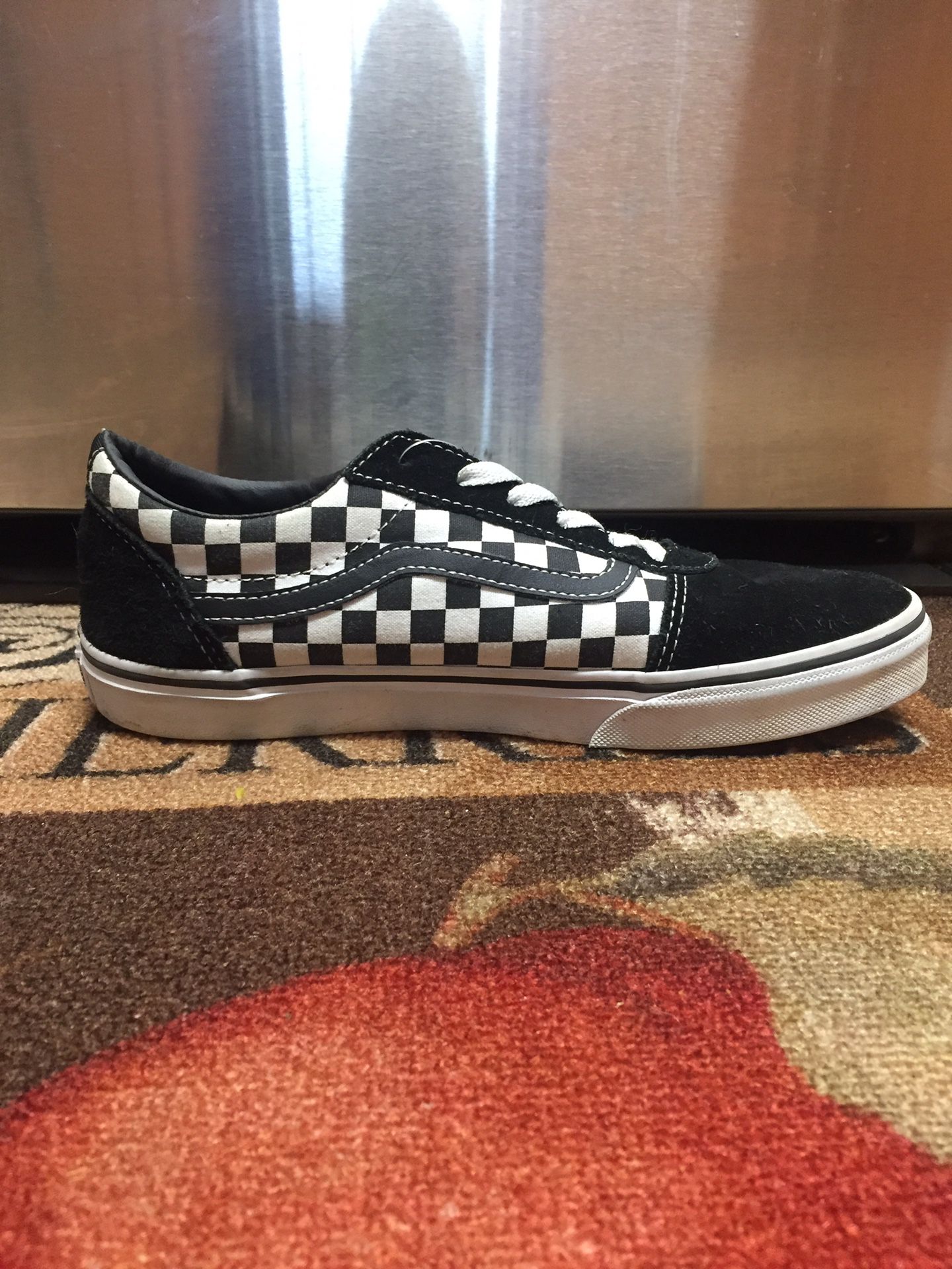 Black and White low top checkered Vans