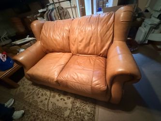 Leather loveseat and ottoman