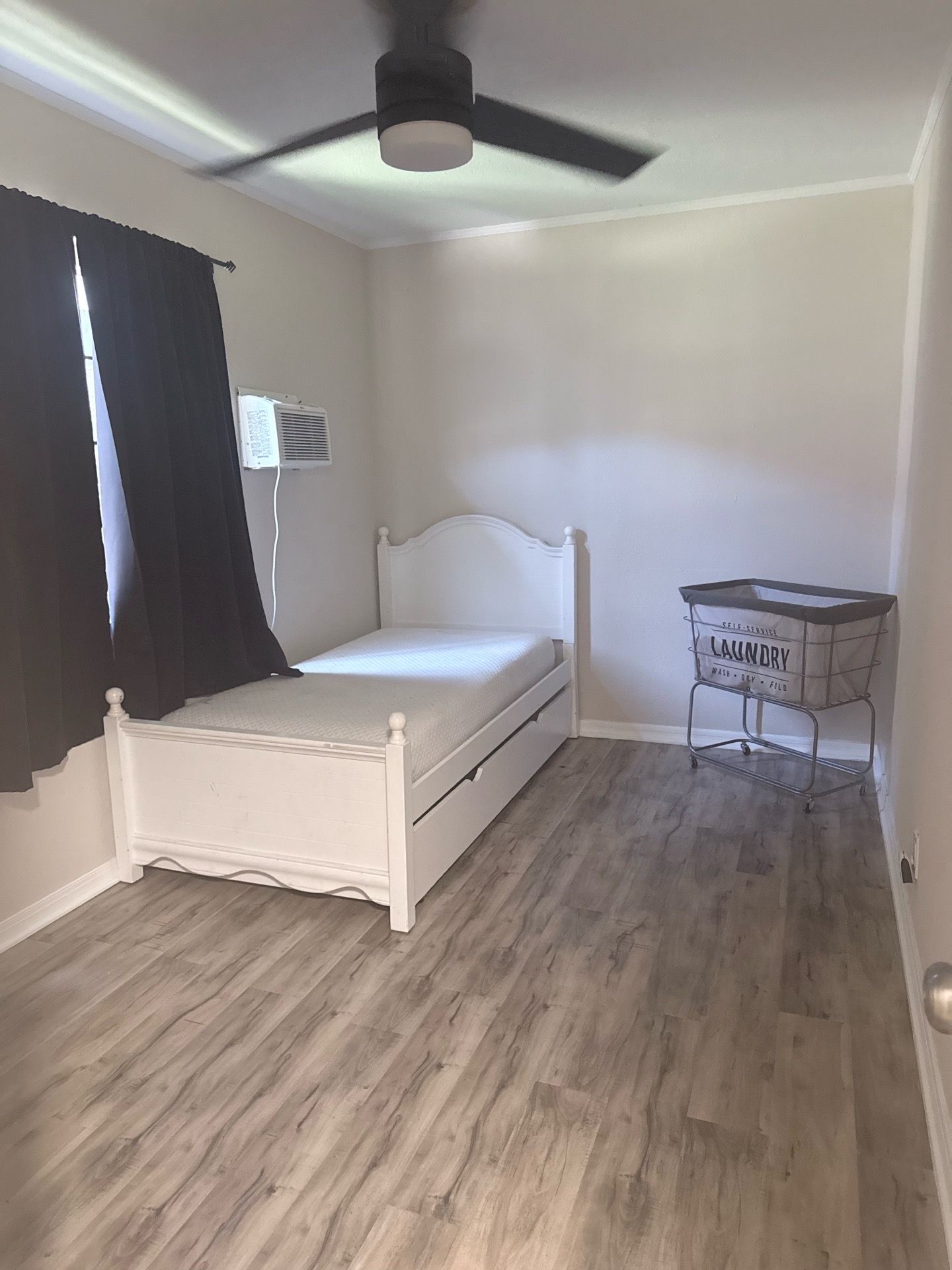 Madison White Twin Wood Panel Bed with a Pull-Out Trundle.