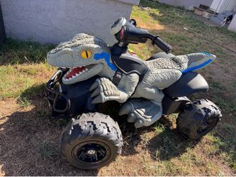 Power wheels velociraptor blue