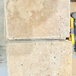 Raw travertine tile with beautiful crystalized veins, measuring 8”x8” Square 