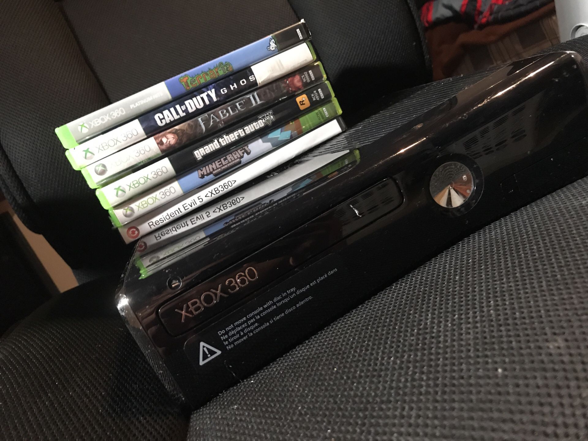 Black xbox 360 with 6 games and turtle beach headset