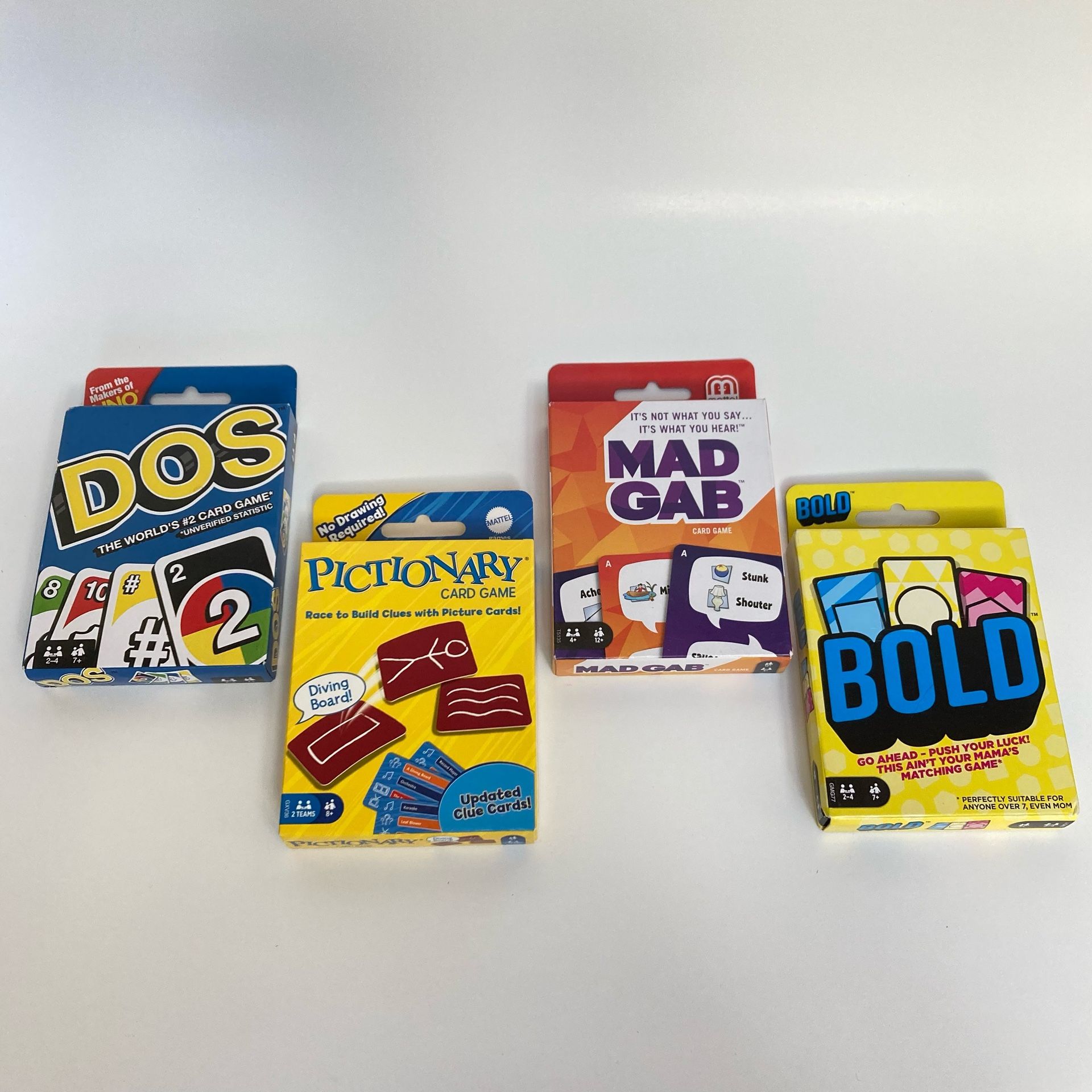 (4) New Card Games - Dos, Pictionary, Mad Gab, Bold
