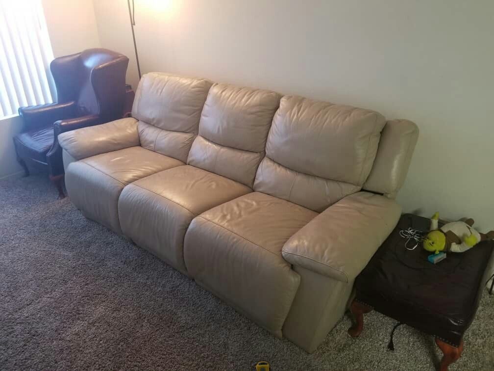 Leather reclining couch, and extra wine coloured single couch, with lampstand