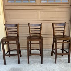 Three Wooden Bar Stools. Used Good Condition. 