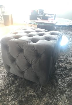 2 grey tufted ottomans with clear legs - like new