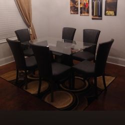 6 Chair Dinette Set With Area Rug And Wall Decor