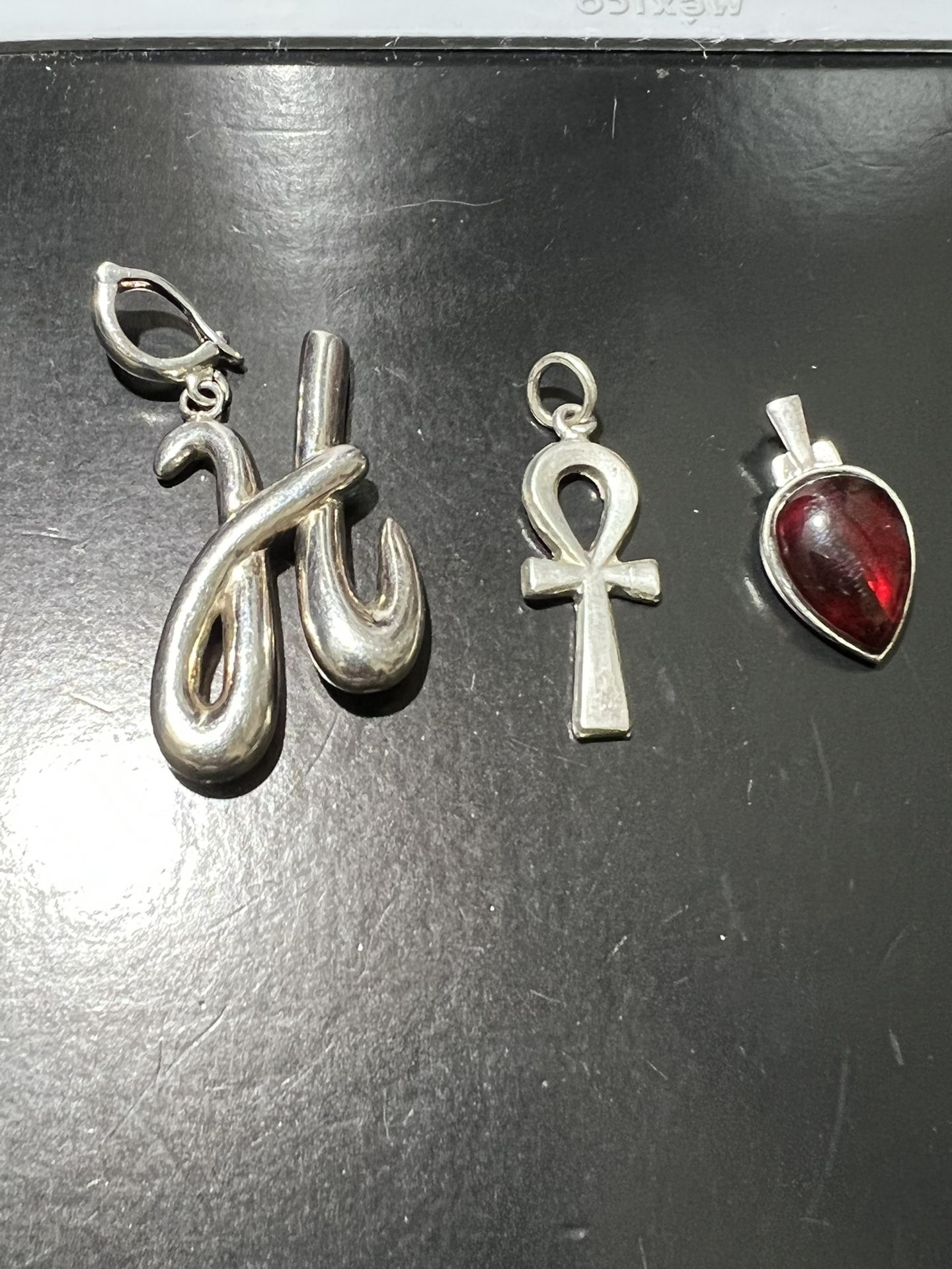 FOUR  PURE STERLING SILVER CHARMS THE THREE MEDIUM SIZE EACH ONE $16 AND BIG ONE IS $25  