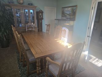 Table and chairs and China hutch