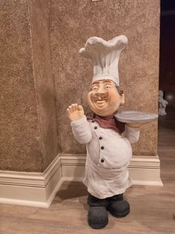 large chef/waiter statue with serving tray
