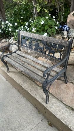 Child’s iron and wood slat bench