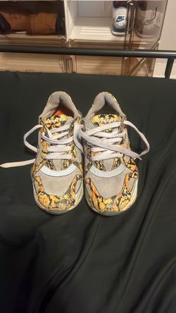Gold Versace shoes