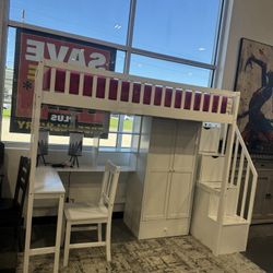 TWIN SIZE LOFT BED WITH INTEGRATED DESK, BOOKSHELF, WARDROBE, AND CHAIR.       