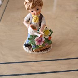 VINTAGE CERAMIC BOY WATERING FLOWERS