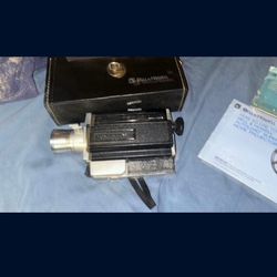 VINTAGE BELL AND HOWELL AUTO LOAD 8 MM MOVIE CAMERA W/ Spotlight, and Auto Load Projector