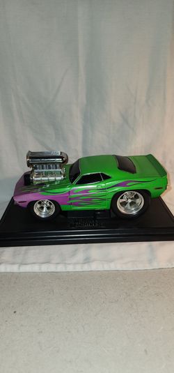 Muscle Machine 1970 Cuda car with Cuda Sign