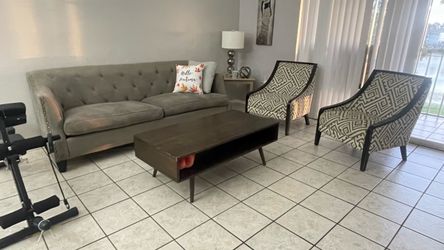 Gray Tufted Sofa with Nailhead Trim