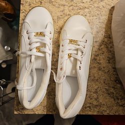 White and gold sneakers