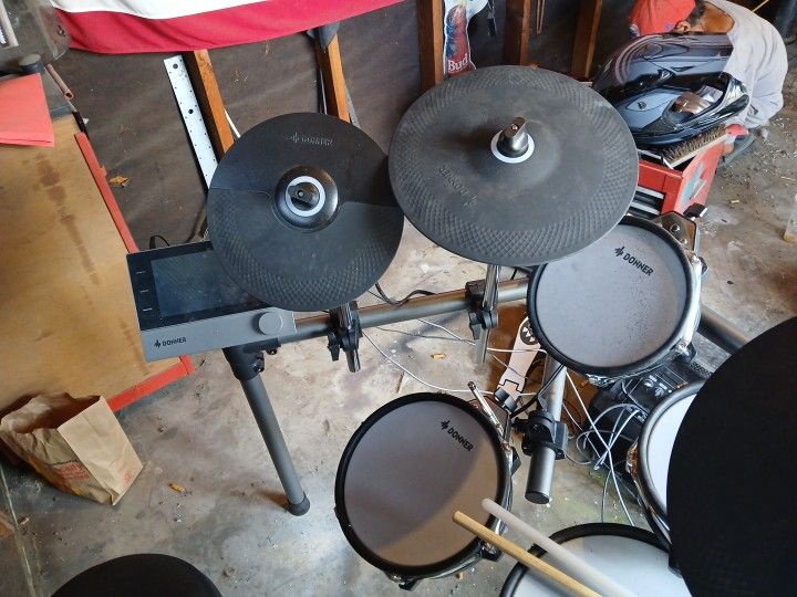 Electric Drum Set An A Flying Guitar With Amp