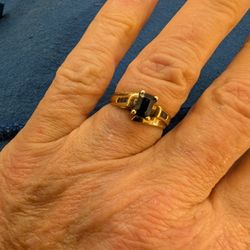 SAPPHIRE RING. EMERALD CUT WITH SAPPHIRES DOWN THE SIDE. THICK BAND SIZE 6