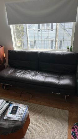 Adjustable fold out leather couch for sale!
