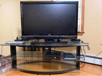 42” LG TV with glass top stand