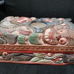 Old Wooden Monkey Box With Candle Holder On Top And Sections Inside The Box