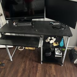Computer desk with adjustable laptop stand